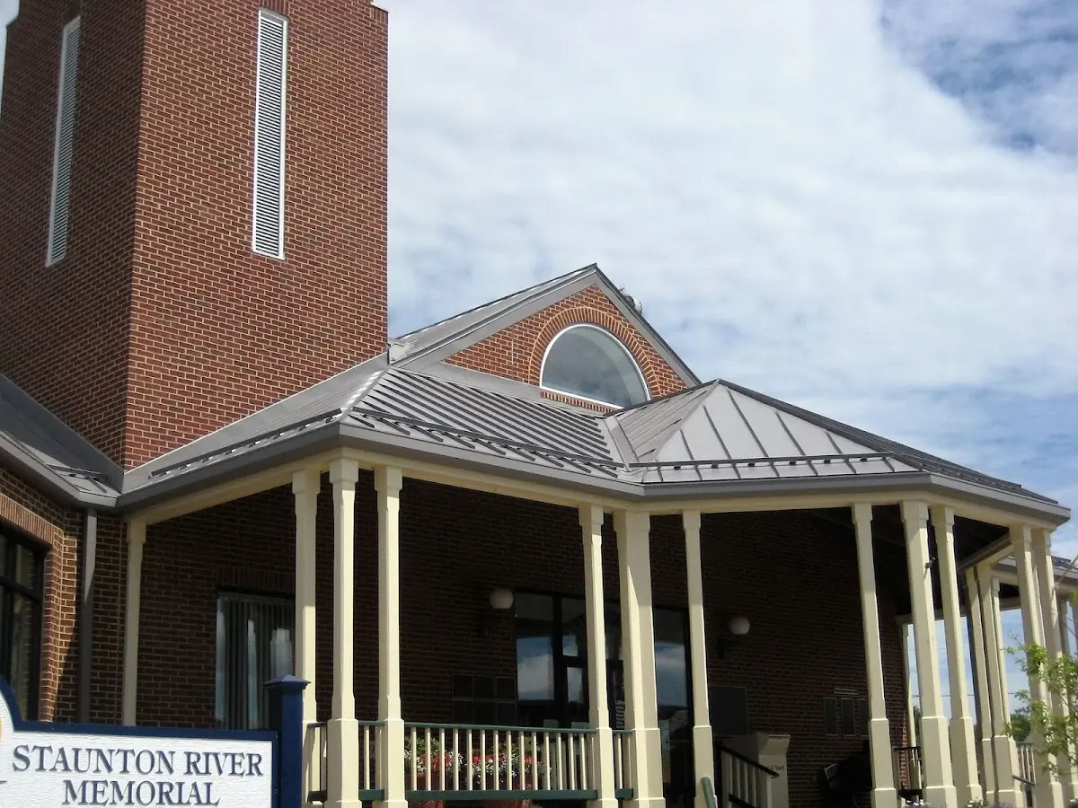 Skilled roofing craftsmen working on a residential roof in South Bend